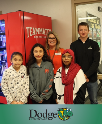  Dodge students posing with TeamMates with new book vending machine.